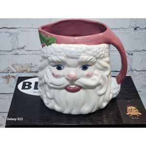Vintage Mercuries Santa mug stamped 1995 on the bottom, measuring 4.5" tall and